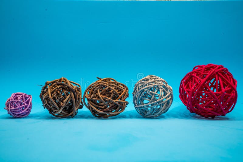 Handmade Straw Balls with a Light Blue Background Stock Photo - Image