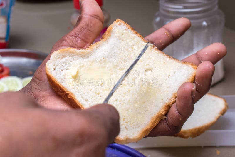 Hands Applying Butter on White Bread with Butter Knife Stock Photo Image of slice, kitchen