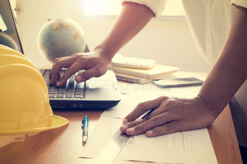 Hands of Architect Working on Laptop with Construction Plan Stock Photo ...