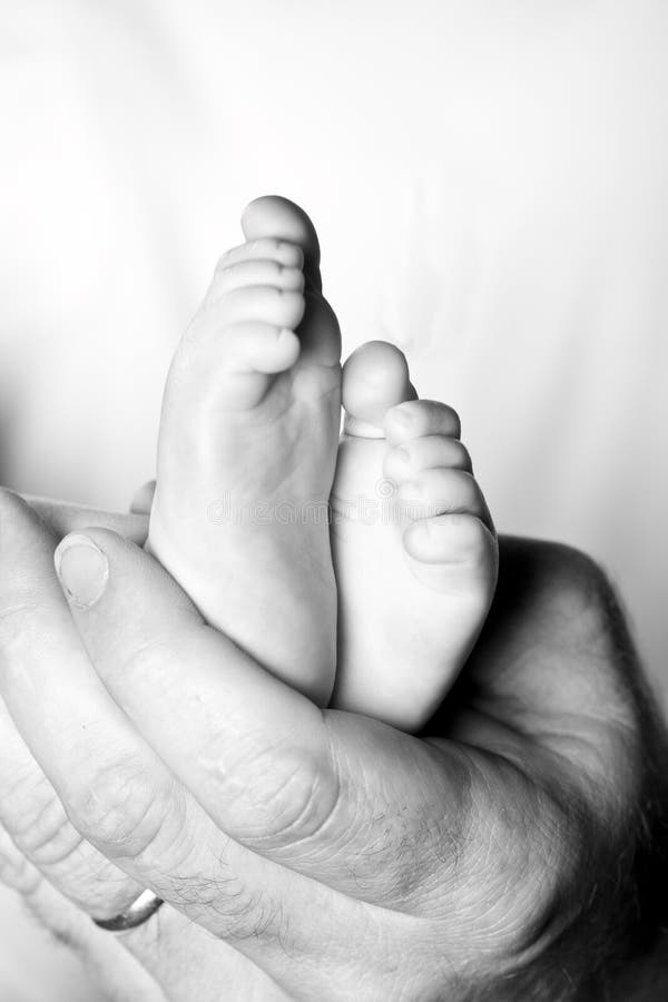 Hands and baby feet