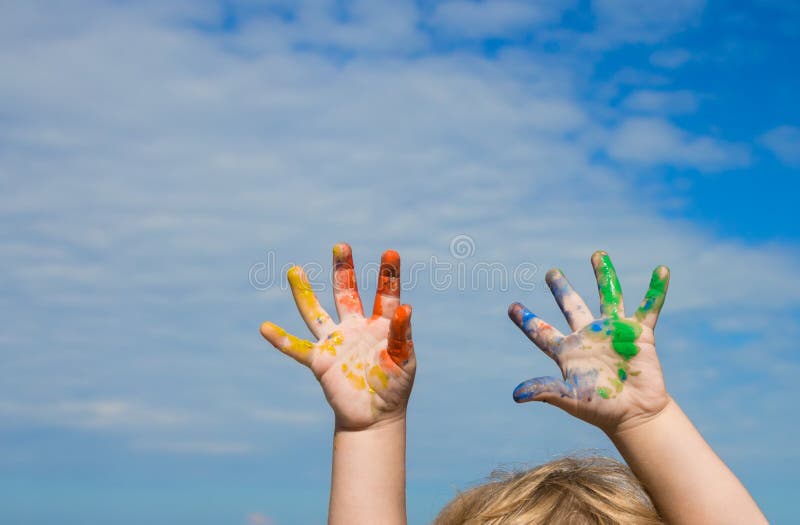 Hands of baby paint against blue sky royalty free stock image Hands of baby paint against blue sky royalty free stock image