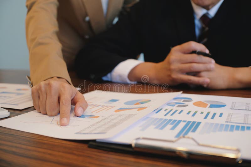 Hands of business people analyzing chart Finance managers task royalty free stock photo