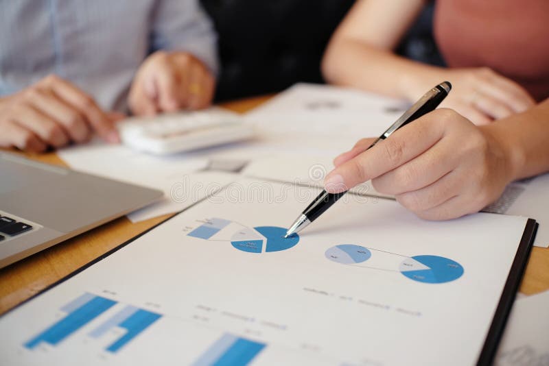 Hands of business people analyzing chart Finance managers task stock images