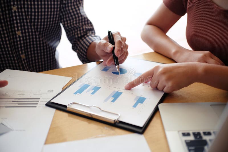 Hands of business people analyzing chart Finance managers task stock photos