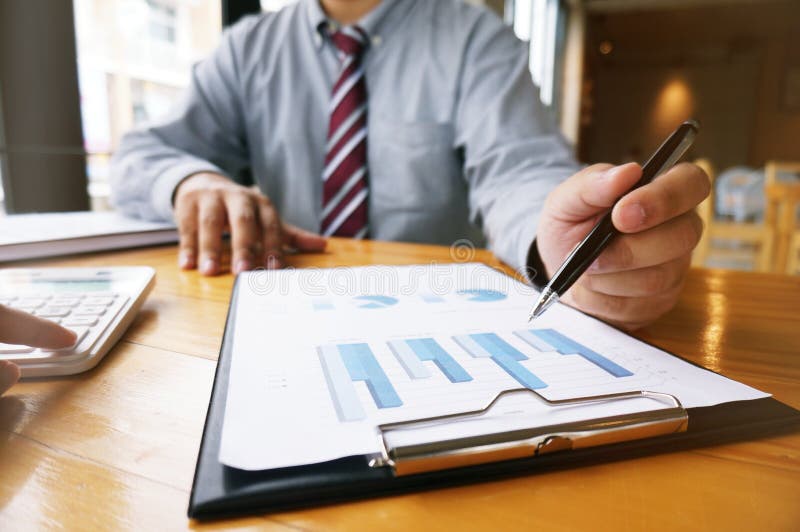 Hands of business people analyzing chart Finance managers task. royalty free stock photos