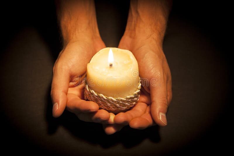 Hands with candle stock image. Image of faithful, hopeful 56124245