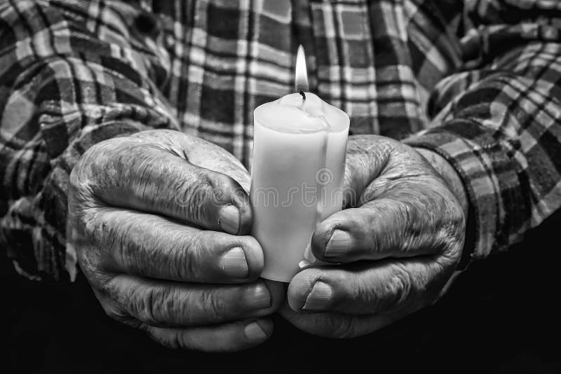 Hands and candle stock image. Image of family, black 69049623