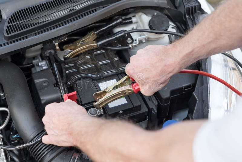 Hands of Car Mechanic Using Car Battery Jumper Cable Stock Photo Image of automobile, vehicle