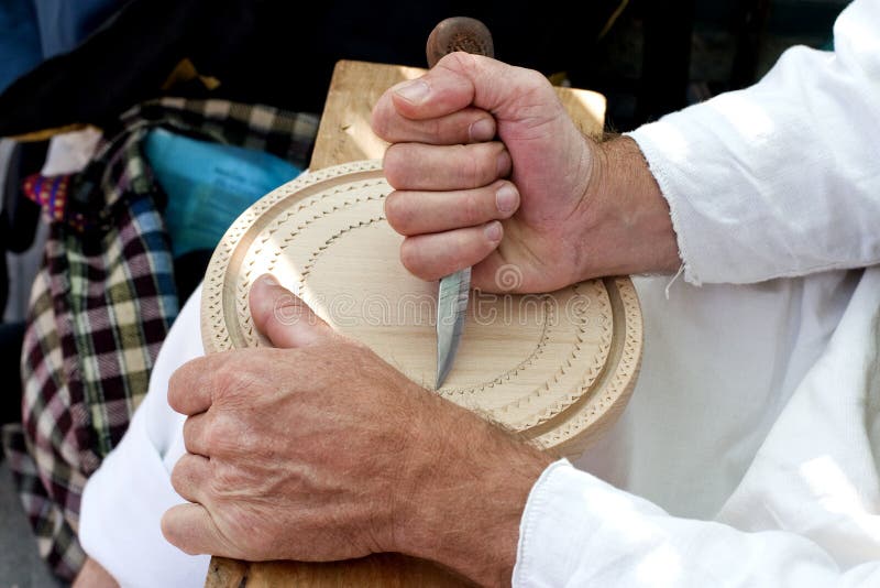Hands carving in wood stock image. Image of tradition 20710485
