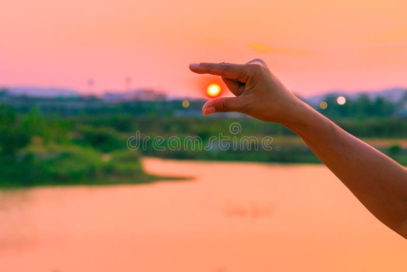 Hands catch sun at sunset time concept. with copy space stock photos Hands catch sun at sunset time concept. with copy space stock photos