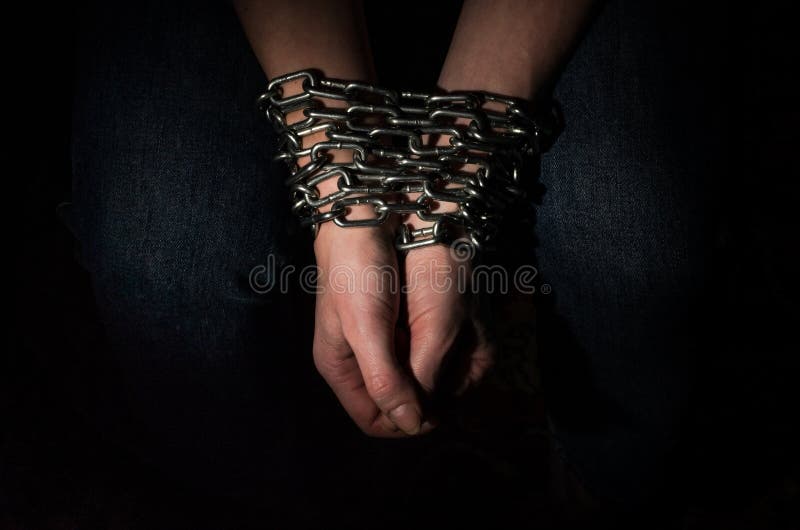Close-Up Shot of a Woman Bound With Chains · Free Stock Photo