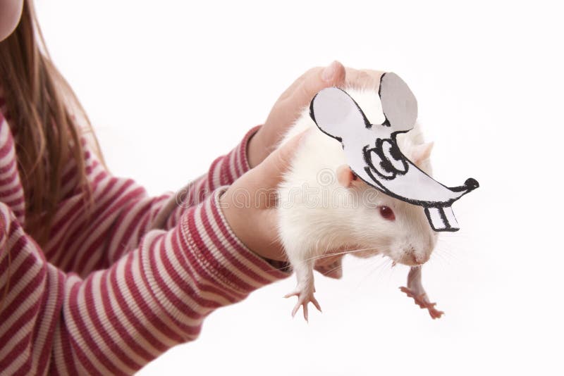 Hands childl hold rat in a mask