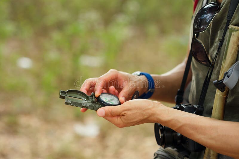 Hands with compass stock image Hands with compass stock image