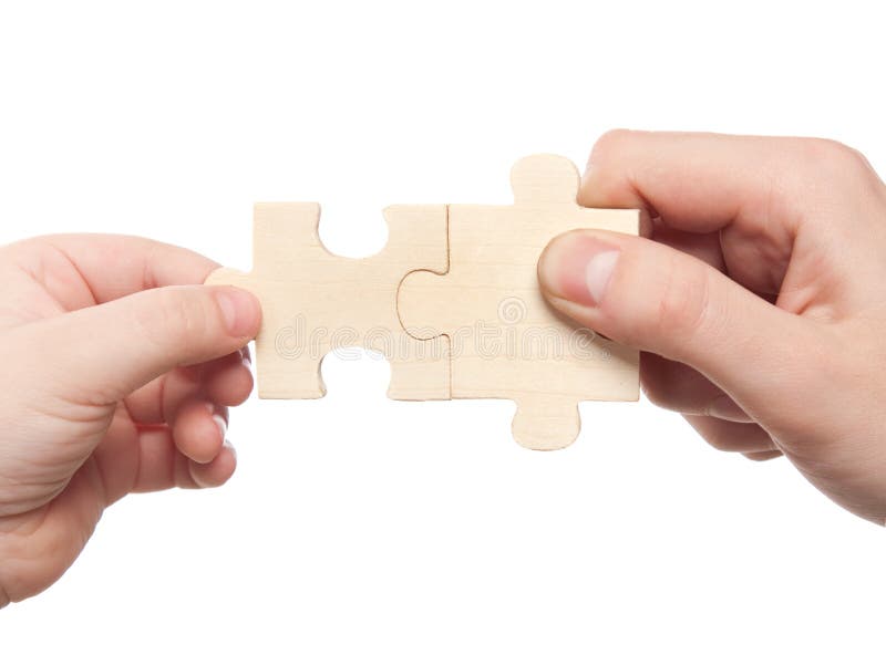 Hands connecting puzzles