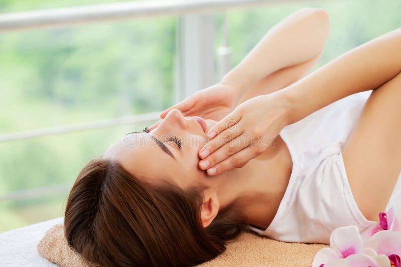 Hands Of Cosmetologist Making Manual Relaxing Rejuvenating Facial Massage For Woman In Beauty