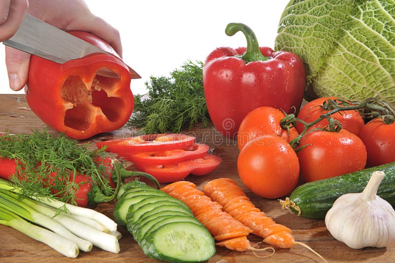 Hands cutting vegetables