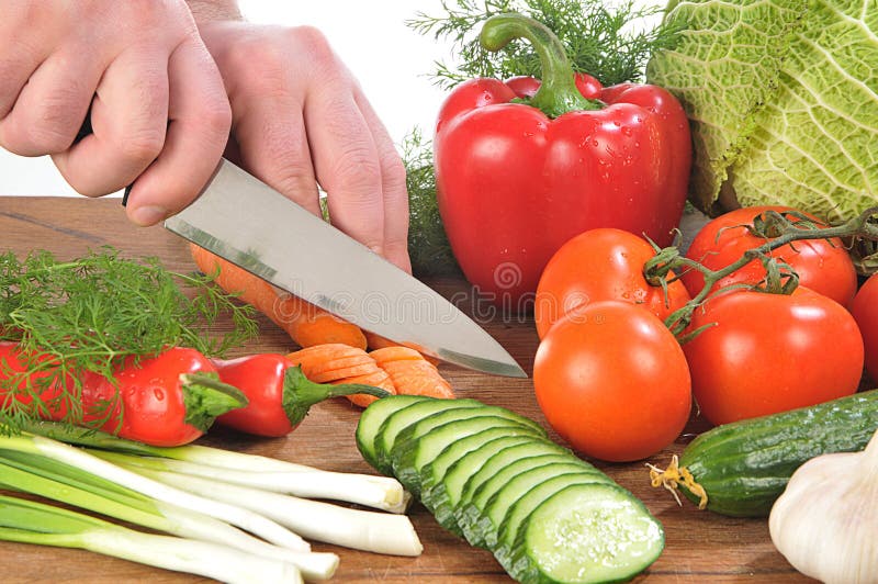 Hands cutting vegetables