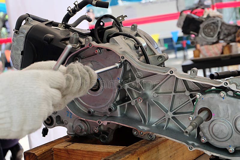 Hands of Disassembly Kit Motorcycle in Repair Service. Stock Image