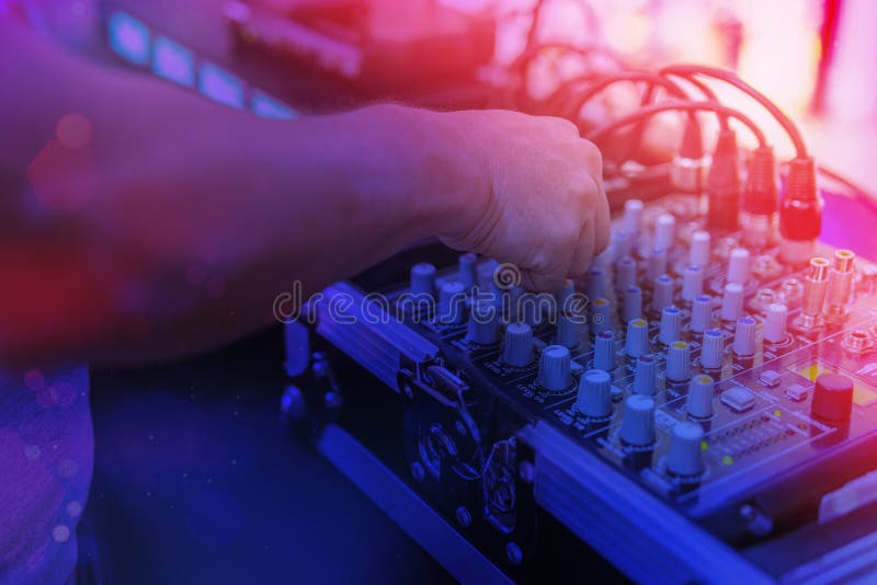 Hands of a Dj Controlling Music on a Mixer Stock Photo Image of