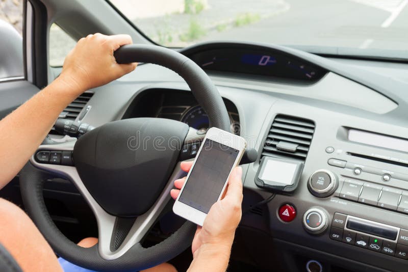 Hands Driving and Holding a Phone Stock Photo Image of interface