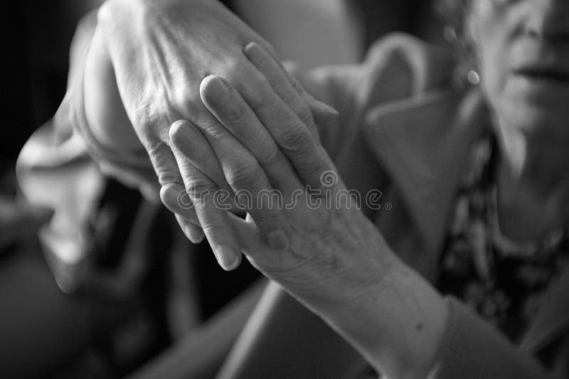 Hands of elderly woman with alzheimer doing massage