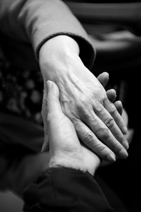 Hands of elderly woman with alzheimer doing massage