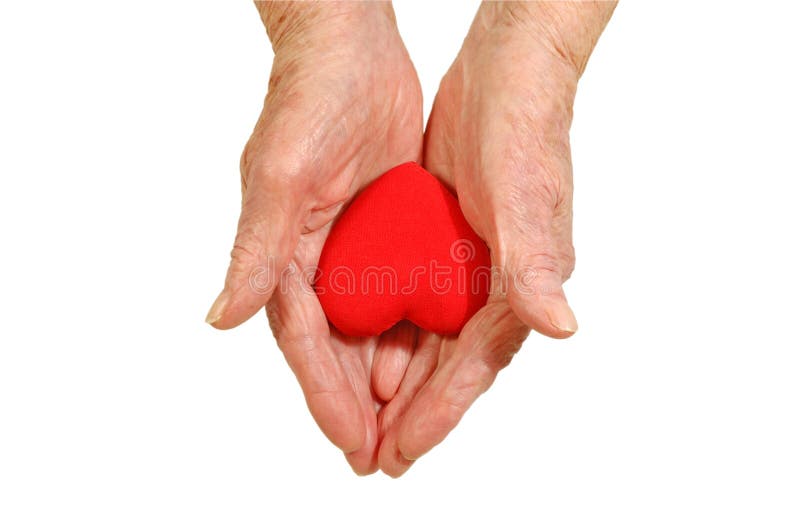 Hands of an elderly woman holding a heart shape