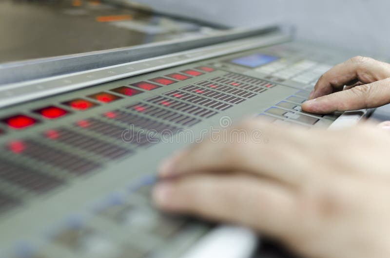 Hands on fountain key unit in offset print plant stock photo