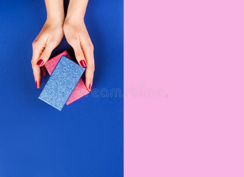 Hands with Gift Box on Pink and Classic Blue Stock Photo Image of