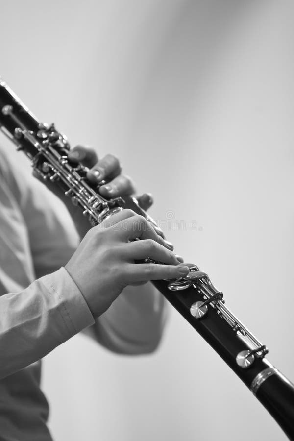 Hands girl playing clarinet royalty free stock image