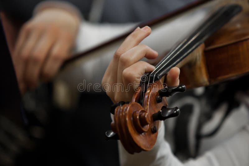 Hands girl playing the violin stock photography