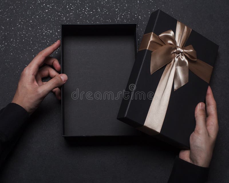 Download The Hands Of A Guy In A Black Shirt Are Holding A Gift Box Opened Black Box Place For An Inscription Mockup Stock Image Image Of Design Inscription 202918111