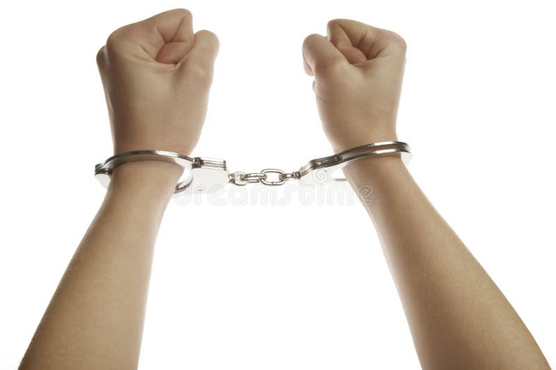 Hands and handcuffs royalty free stock photography