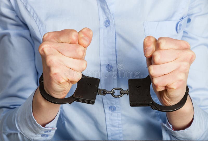 Hands in handcuffs royalty free stock photography