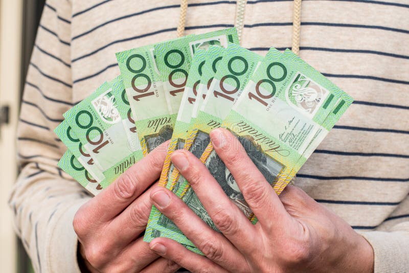 Hands holding australian dollars 100 banknotes stock image