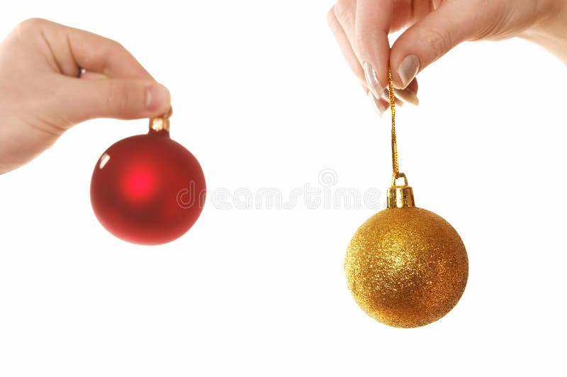 Hands holding Christmas balls