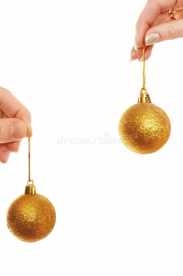 Hands holding Christmas balls