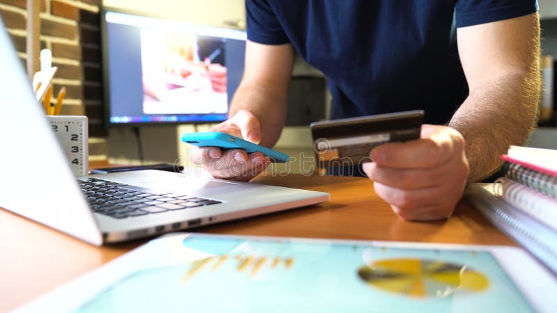 Hands holding credit card and using smartphone. stock video