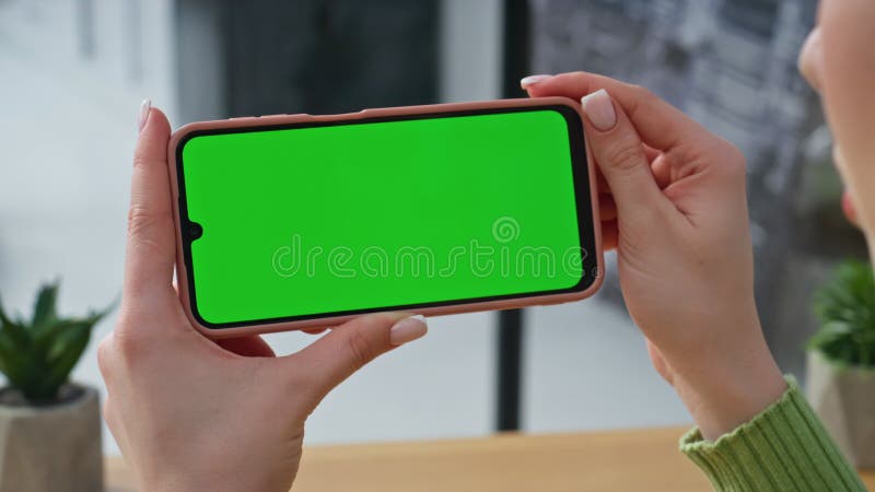 Hands holding horizontal mockup mobile phone at corporate workplace closeup stock video footage