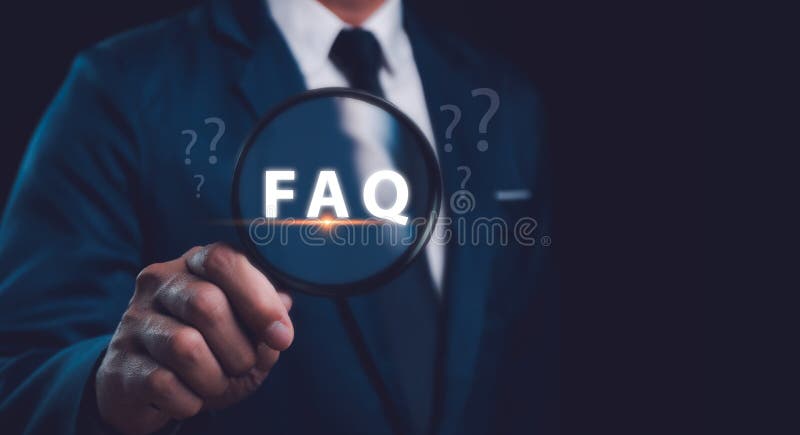 Hands holding magnifying glass focused on FAQ question mark sign. Question Mark and Problem-Solving Concept. Finding answers to royalty free stock photography