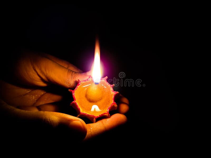 Hands holding oil lamp during diwali festival of lights. royalty free stock photography Hands holding oil lamp during diwali festival of lights. royalty free stock photography