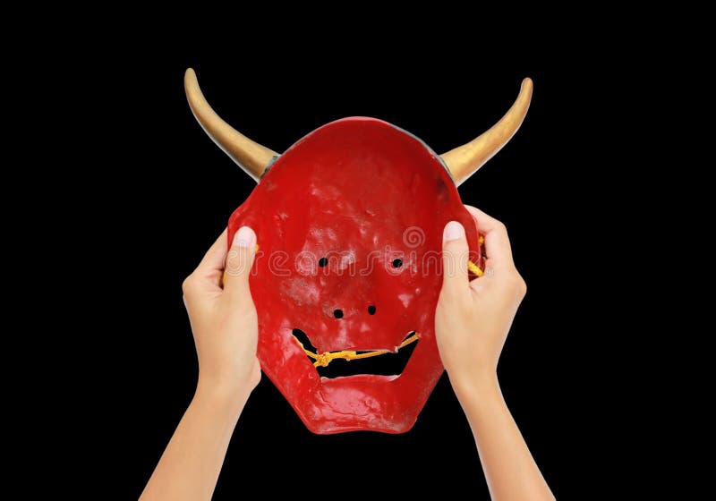 Hands Holding Red Kabuki Mask Isolated on Black Background Stock Image