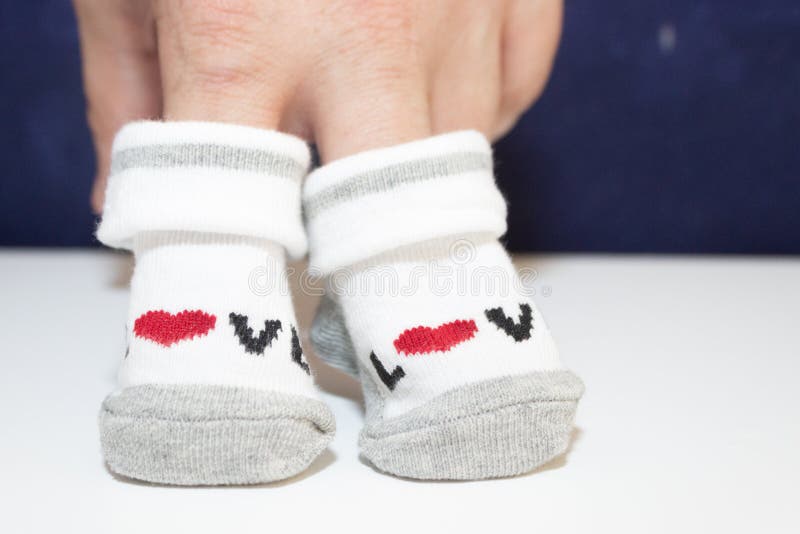 Hands Holding Small Baby Socks Stock Image Image of closeup, arms