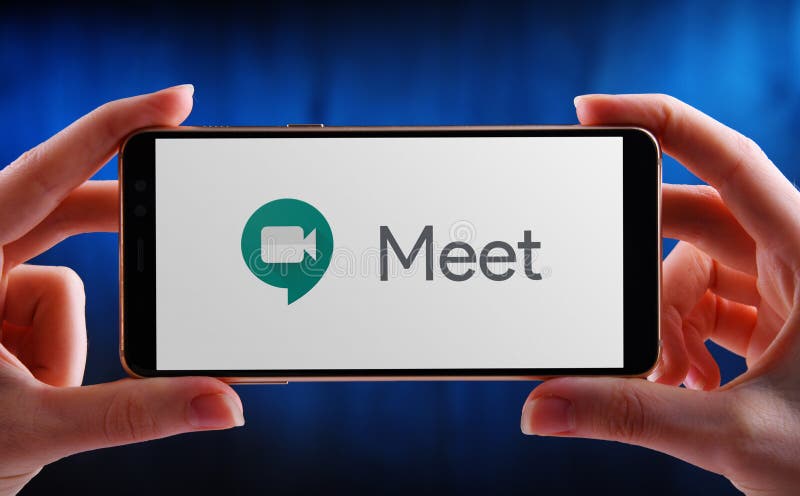 POZNAN, POL - MAY 21, 2020: Hands holding smartphone displaying logo of Google Meet, a video communication service developed by Google