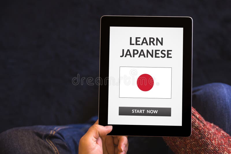 Learn Japanese Concept on Tablet Screen with Office Objects Stock Photo