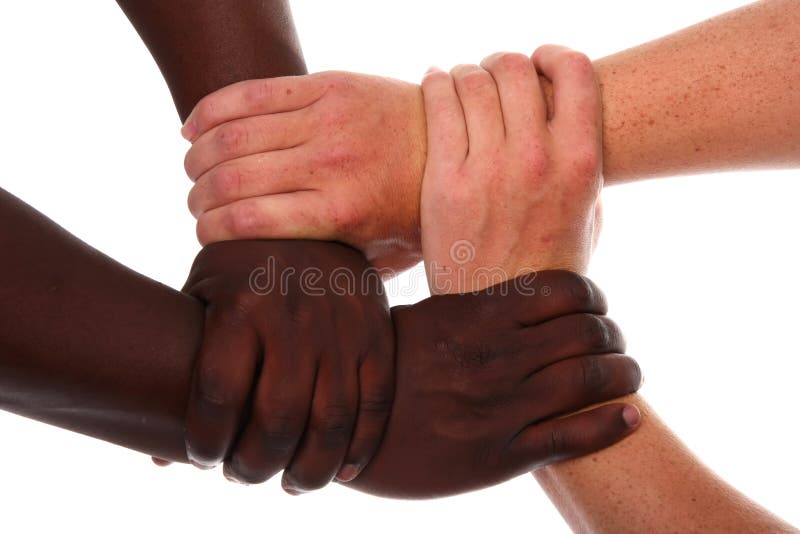 Each of the four hands is clasped around the friends wrist. One hand grips  the other, and so on. Young girls hands. Stock Photo by ©info.fotodrobik.pl  424891214