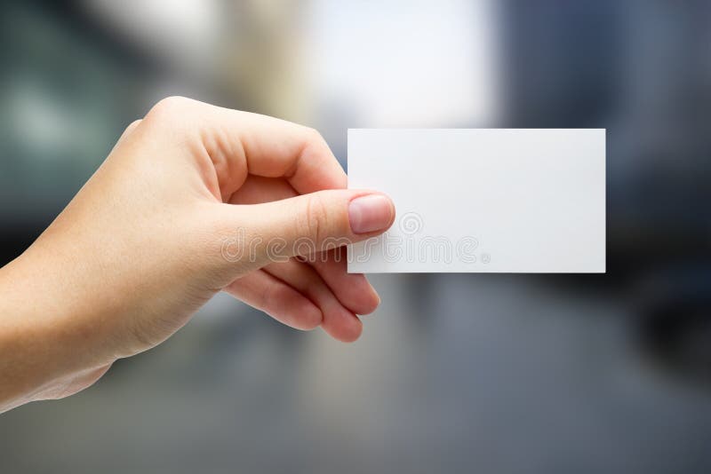 Hands holding a white business visit card, gift, ticket, pass, p royalty free stock image Hands holding a white business visit card, gift, ticket, pass, p royalty free stock image
