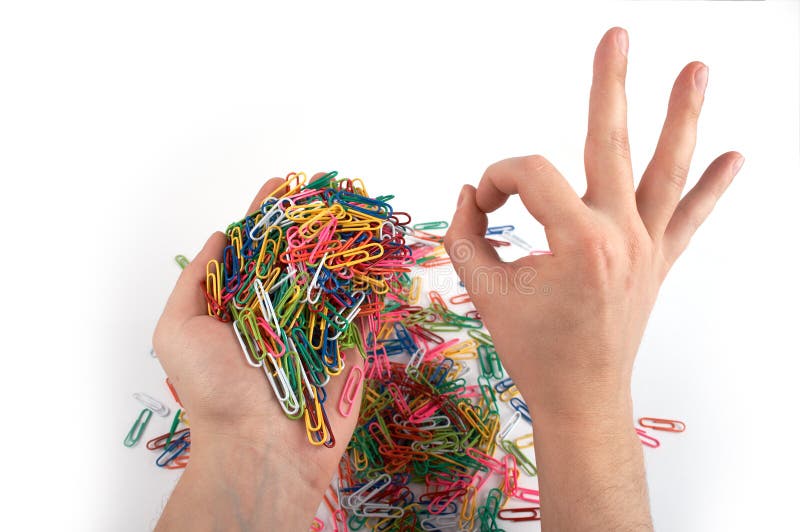 Hands holds paper clips and gives gesture 3