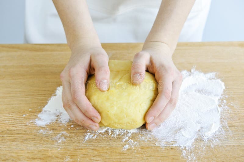 Hands kneading dough royalty free stock image