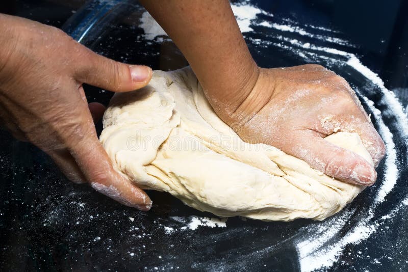 Hands kneading a dough stock image. Image of ingredient 46924655